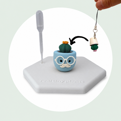 Cactus Pal keychain shown dropping into the Chilly Chap pot as a forever plant backup