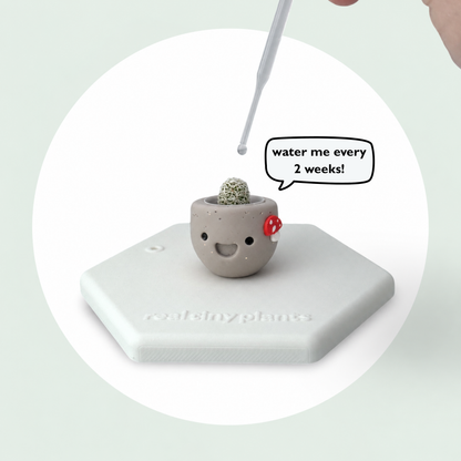 Dropper watering Mushroom Munchkin with a speech bubble that says water me every 2 weeks