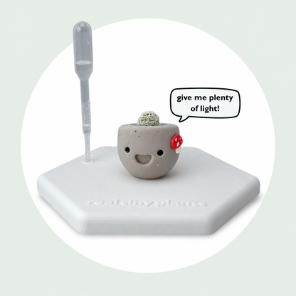 Mushroom Munchkin on its magnetic coaster with a speech bubble that says give me plenty of light