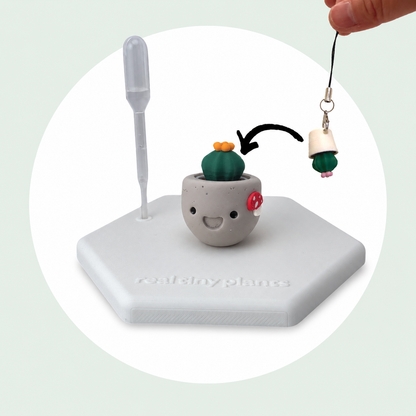 Cactus Pal keychain shown dropping into the Mushroom Munchkin pot as a forever plant backup
