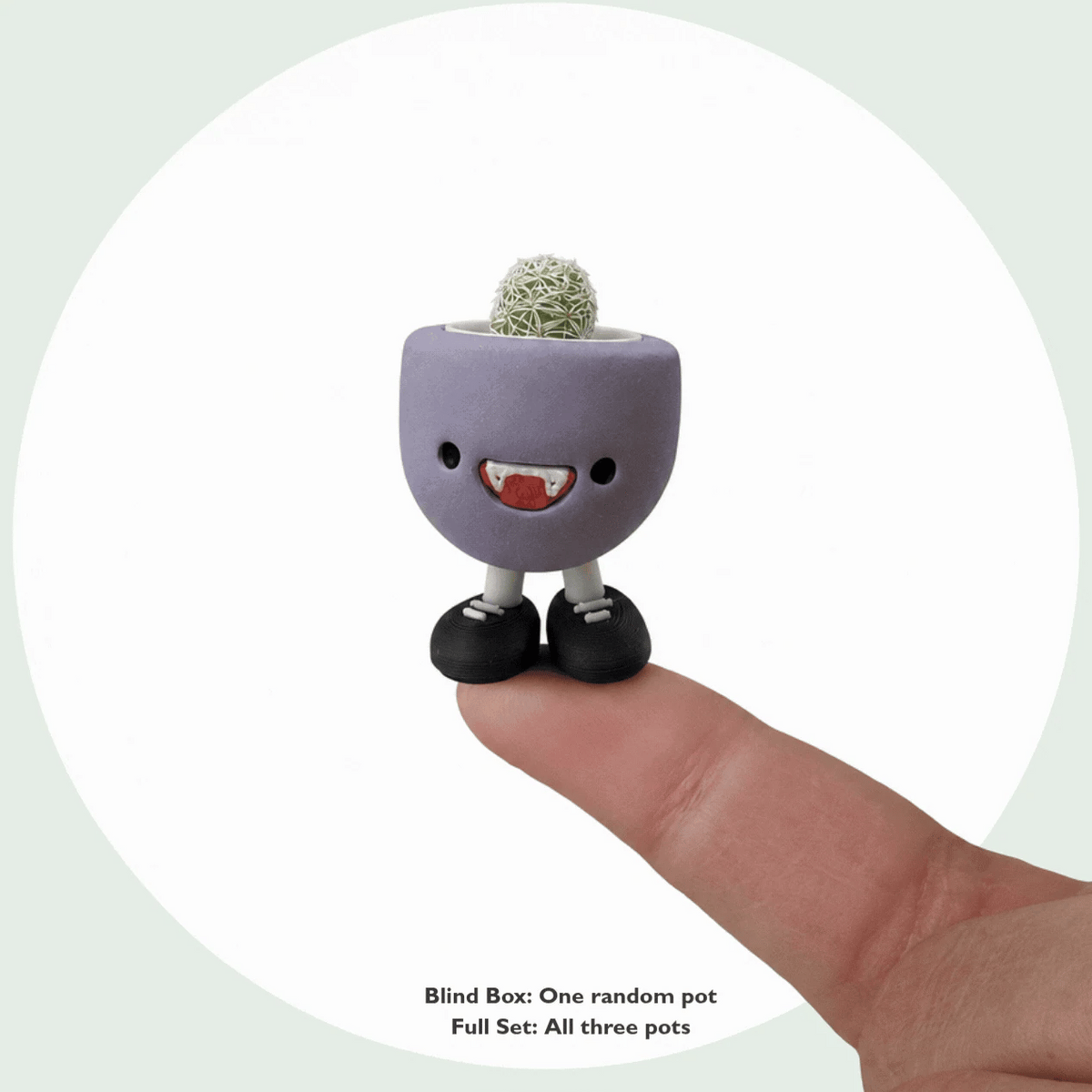 Galactic Cat, Happy Ghost and Vamps Jr. taking turns on a fingertip to show their tiny size