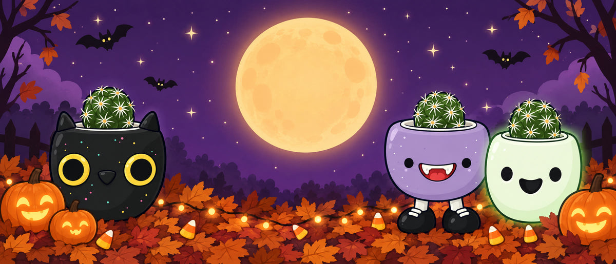 Galactic Cat, Vamps Jr. and Happy Ghost as cartoons under a Halloween full moon with jack-o'-lanterns